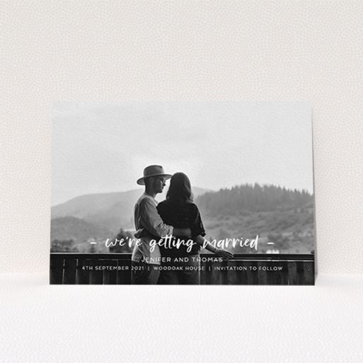 A wedding save the date called "To the Point". It is an A6 save the date in a landscape orientation. It is a photographic wedding save the date with room for 1 photo. "To the Point" is available as a flat save the date, with mainly white colouring.