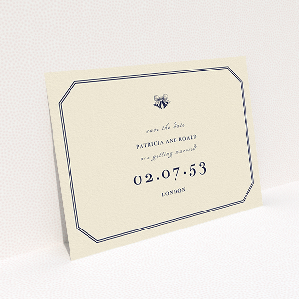 A wedding save the date design titled "Wedding bells". It is an A6 save the date in a landscape orientation. "Wedding bells" is available as a flat save the date, with tones of cream and navy blue.