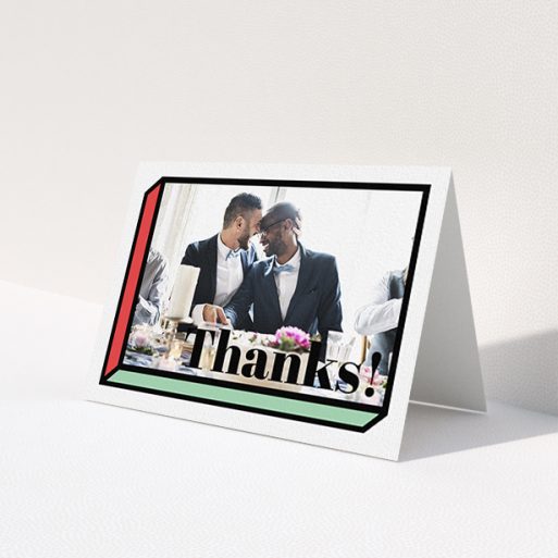 A wedding thank you card called '3D Thank You'. It is an A6 card in a landscape orientation. It is a photographic wedding thank you card with room for 1 photo. '3D Thank You' is available as a folded card, with tones of red, green and black.
