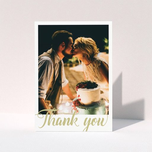 A wedding thank you card design called "A big thank you". It is an A5 card in a portrait orientation. It is a photographic wedding thank you card with room for 1 photo. "A big thank you" is available as a folded card, with tones of white and gold.
