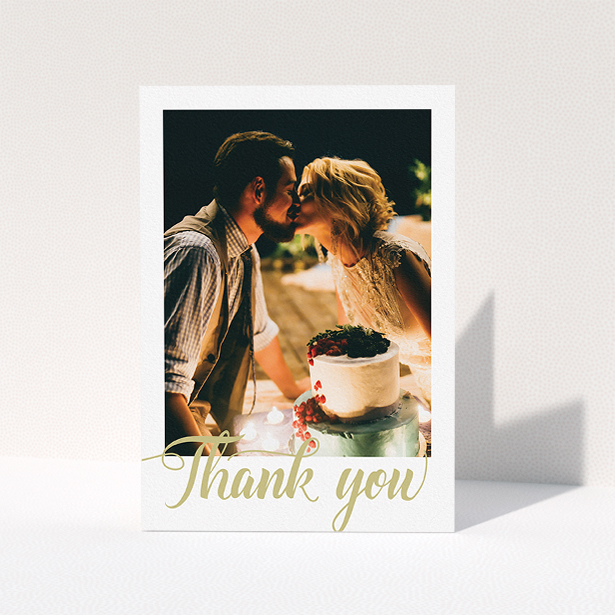 A wedding thank you card design called "A big thank you". It is an A5 card in a portrait orientation. It is a photographic wedding thank you card with room for 1 photo. "A big thank you" is available as a folded card, with tones of white and gold.