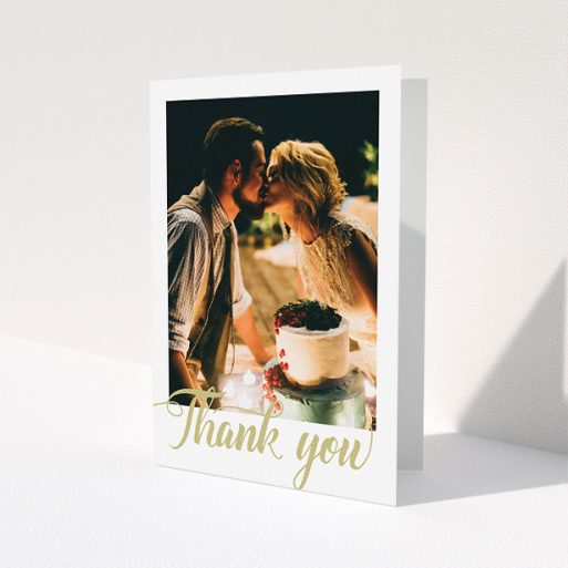 A wedding thank you card design called 'A big thank you'. It is an A5 card in a portrait orientation. It is a photographic wedding thank you card with room for 1 photo. 'A big thank you' is available as a folded card, with tones of white and gold.