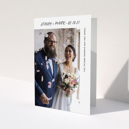 A wedding thank you card design named 'Around the Corner Photo'. It is an A5 card in a portrait orientation. It is a photographic wedding thank you card with room for 1 photo. 'Around the Corner Photo' is available as a folded card, with mainly white colouring.