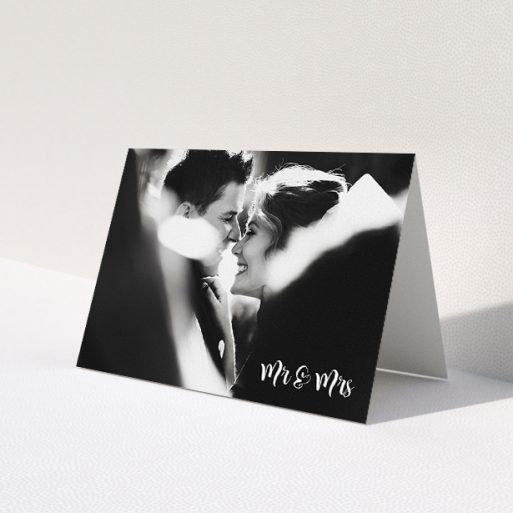 A wedding thank you card called 'Black and White'. It is an A5 card in a landscape orientation. It is a photographic wedding thank you card with room for 1 photo. 'Black and White' is available as a folded card, with mainly white colouring.