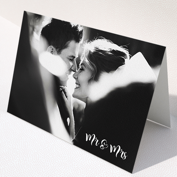 A wedding thank you card called "Black and White". It is an A5 card in a landscape orientation. It is a photographic wedding thank you card with room for 1 photo. "Black and White" is available as a folded card, with mainly white colouring.