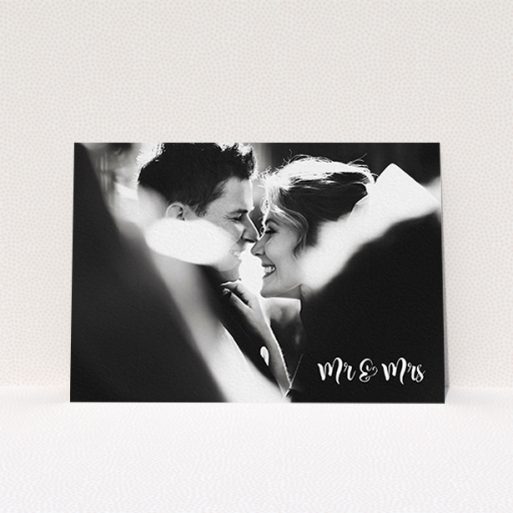 A wedding thank you card design called "Black and White". It is an A6 card in a landscape orientation. It is a photographic wedding thank you card with room for 1 photo. "Black and White" is available as a flat card, with mainly white colouring.