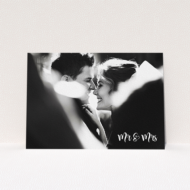 A wedding thank you card design called "Black and White". It is an A6 card in a landscape orientation. It is a photographic wedding thank you card with room for 1 photo. "Black and White" is available as a flat card, with mainly white colouring.