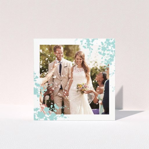 A wedding thank you card design named "Blue blossom". It is a square (148mm x 148mm) card in a square orientation. It is a photographic wedding thank you card with room for 1 photo. "Blue blossom" is available as a folded card, with tones of blue and white.