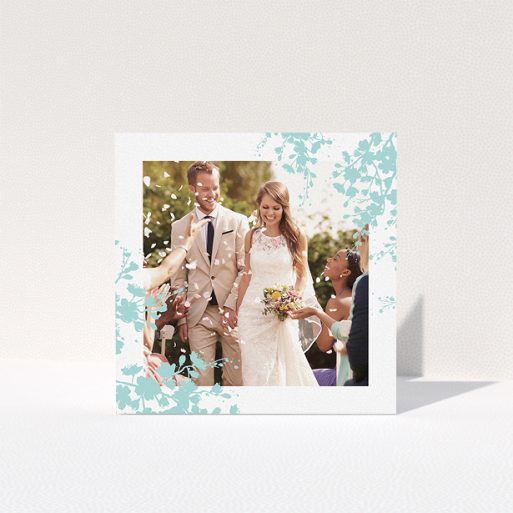 A wedding thank you card design named "Blue blossom". It is a square (148mm x 148mm) card in a square orientation. It is a photographic wedding thank you card with room for 1 photo. "Blue blossom" is available as a folded card, with tones of blue and white.