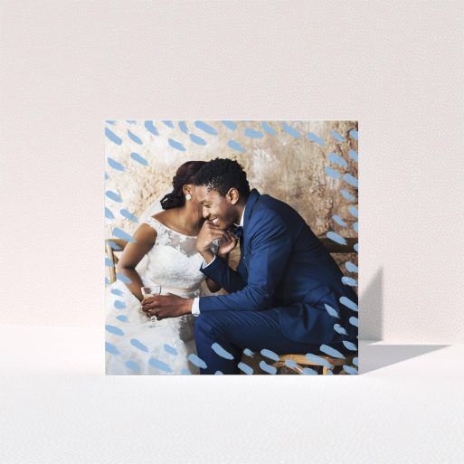 A wedding thank you card template titled "Blue smudge". It is a square (148mm x 148mm) card in a square orientation. It is a photographic wedding thank you card with room for 1 photo. "Blue smudge" is available as a folded card, with mainly blue colouring.
