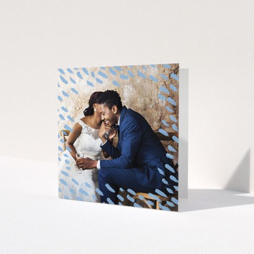 A wedding thank you card template titled 'Blue smudge'. It is a square (148mm x 148mm) card in a square orientation. It is a photographic wedding thank you card with room for 1 photo. 'Blue smudge' is available as a folded card, with mainly blue colouring.