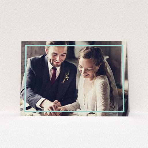 A wedding thank you card design called "Blue White Photo Frame". It is an A6 card in a landscape orientation. It is a photographic wedding thank you card with room for 1 photo. "Blue White Photo Frame" is available as a flat card, with mainly blue colouring.