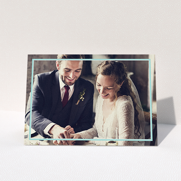 A wedding thank you card template titled "Blue White Photo Frame". It is an A6 card in a landscape orientation. It is a photographic wedding thank you card with room for 1 photo. "Blue White Photo Frame" is available as a folded card, with mainly blue colouring.