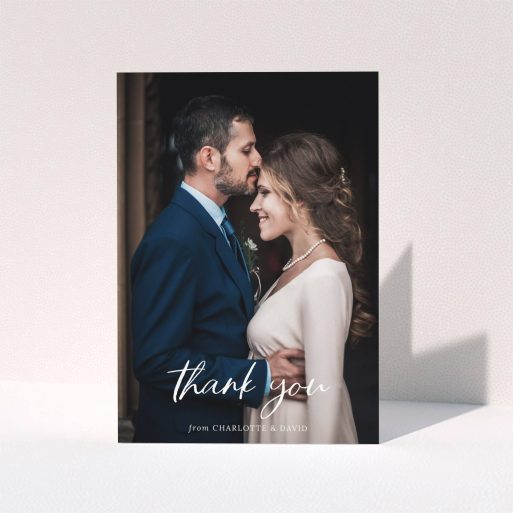 Wedding Thank You Card Design - "Calligraphy Thanks" A wedding thank you card design titled "Calligraphy Thanks". It is an A5 card in a portrait orientation. It is a photographic wedding thank you card with room for 1 photo. "Calligraphy Thanks" is available as a folded card, with mainly white colouring.