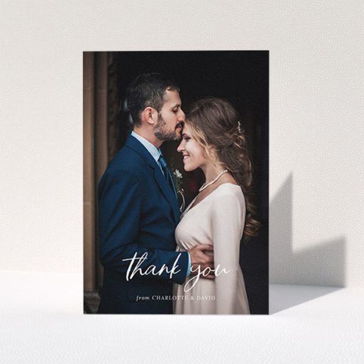 A wedding thank you card design called "Calligraphy Thanks". It is an A6 card in a portrait orientation. It is a photographic wedding thank you card with room for 1 photo. "Calligraphy Thanks" is available as a folded card, with mainly white colouring.
