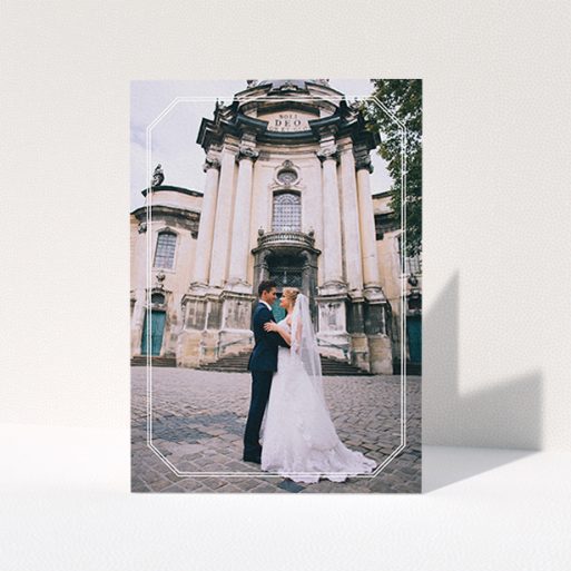 A wedding thank you card design titled "Chiselled border". It is an A6 card in a portrait orientation. It is a photographic wedding thank you card with room for 1 photo. "Chiselled border" is available as a folded card, with mainly white colouring.