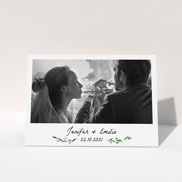 A wedding thank you card named "Classic Floral". It is an A5 card in a landscape orientation. It is a photographic wedding thank you card with room for 1 photo. "Classic Floral" is available as a folded card, with tones of green and white.