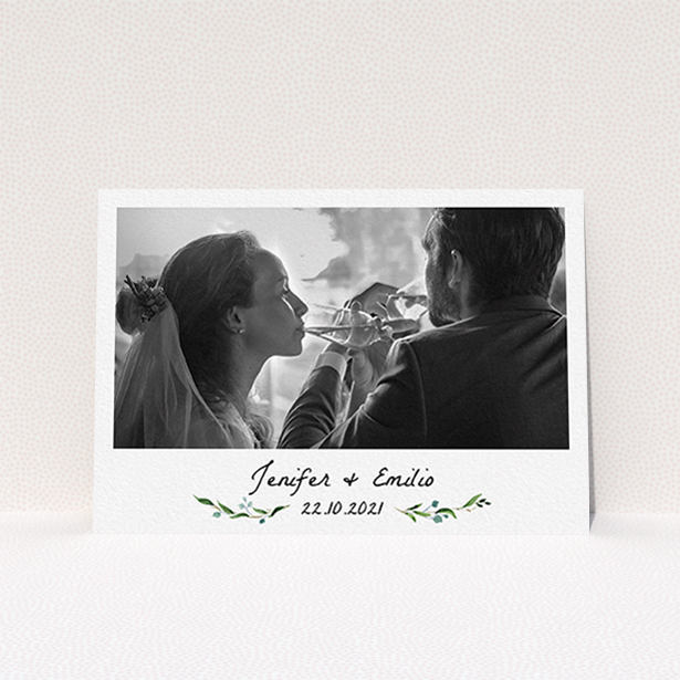 A wedding thank you card design named "Classic Floral". It is an A6 card in a landscape orientation. It is a photographic wedding thank you card with room for 1 photo. "Classic Floral" is available as a flat card, with tones of green and white.