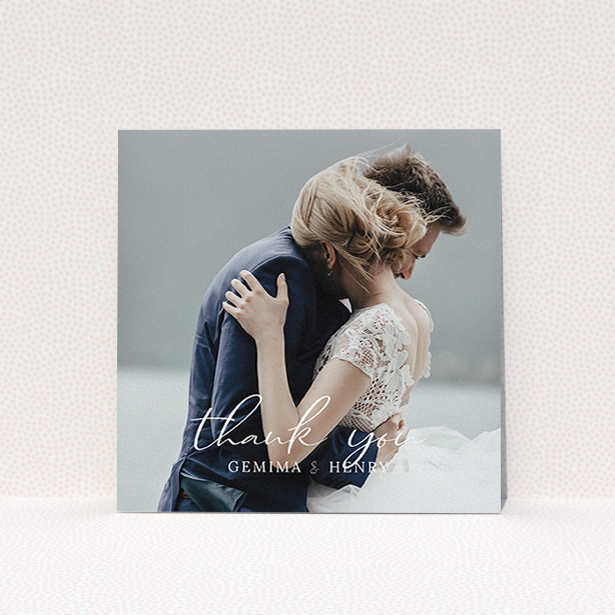 A wedding thank you card called "Classic Thank You". It is a square (148mm x 148mm) card in a square orientation. It is a photographic wedding thank you card with room for 1 photo. "Classic Thank You" is available as a flat card, with mainly white colouring.