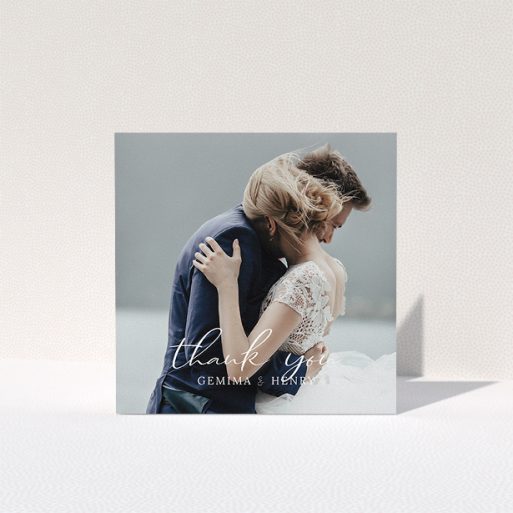 A wedding thank you card design named "Classic Thank You". It is a square (148mm x 148mm) card in a square orientation. It is a photographic wedding thank you card with room for 1 photo. "Classic Thank You" is available as a folded card, with mainly white colouring.