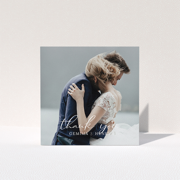 A wedding thank you card design named "Classic Thank You". It is a square (148mm x 148mm) card in a square orientation. It is a photographic wedding thank you card with room for 1 photo. "Classic Thank You" is available as a folded card, with mainly white colouring.