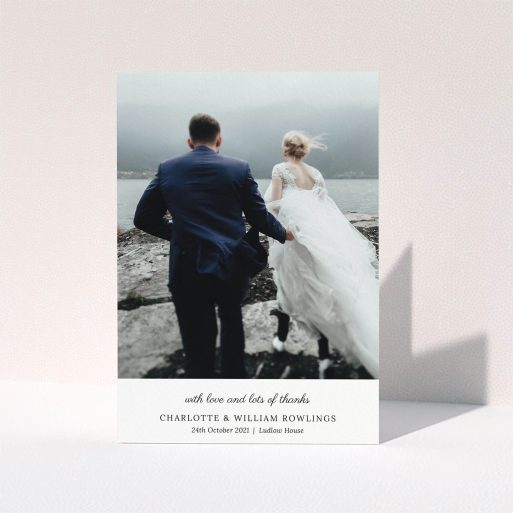 A wedding thank you card template titled "Classic Wedding Thanks". It is an A5 card in a portrait orientation. It is a photographic wedding thank you card with room for 1 photo. "Classic Wedding Thanks" is available as a folded card, with mainly white colouring.