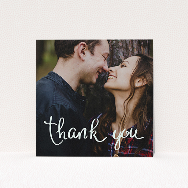 A wedding thank you card design called "Curly thank you". It is a square (148mm x 148mm) card in a square orientation. It is a photographic wedding thank you card with room for 1 photo. "Curly thank you" is available as a flat card, with mainly white colouring.