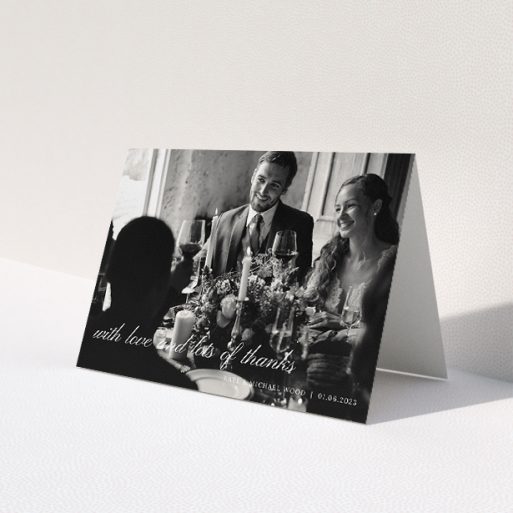 A wedding thank you card called 'Elegant Photo Thanks'. It is an A5 card in a landscape orientation. It is a photographic wedding thank you card with room for 1 photo. 'Elegant Photo Thanks' is available as a folded card, with mainly white colouring.
