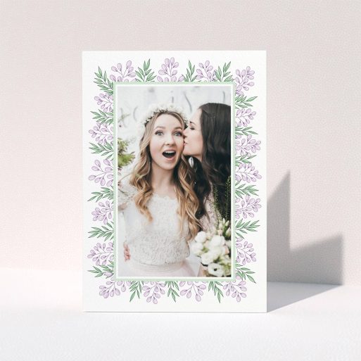 A wedding thank you card called "Floral Thank You Card". It is an A6 card in a portrait orientation. It is a photographic wedding thank you card with room for 1 photo. "Floral Thank You Card" is available as a folded card, with tones of purple and green.