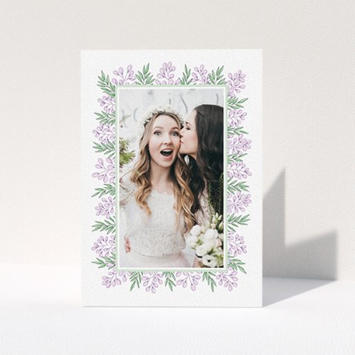A wedding thank you card called "Floral Thank You Card". It is an A6 card in a portrait orientation. It is a photographic wedding thank you card with room for 1 photo. "Floral Thank You Card" is available as a folded card, with tones of purple and green.