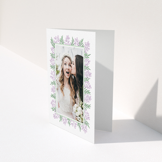 A wedding thank you card called "Floral Thank You Card". It is an A6 card in a portrait orientation. It is a photographic wedding thank you card with room for 1 photo. "Floral Thank You Card" is available as a folded card, with tones of purple and green.