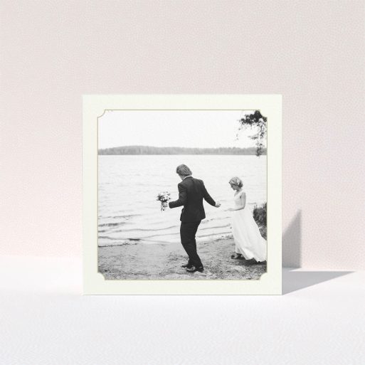 A wedding thank you card design titled "Gold & Cream Notch Frame". It is a square (148mm x 148mm) card in a square orientation. It is a photographic wedding thank you card with room for 1 photo. "Gold & Cream Notch Frame" is available as a folded card, with mainly cream colouring.