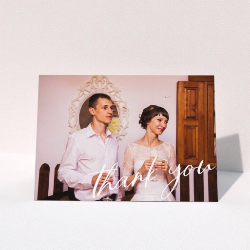 A wedding thank you card design titled "Handwritten Thanks". It is an A5 card in a landscape orientation. It is a photographic wedding thank you card with room for 1 photo. "Handwritten Thanks" is available as a folded card, with mainly white colouring.