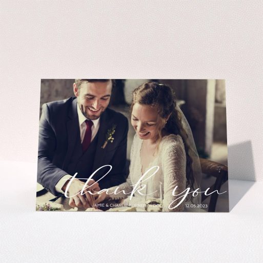 A wedding thank you card design called "Handwritten Thanks". It is an A5 card in a landscape orientation. It is a photographic wedding thank you card with room for 1 photo. "Handwritten Thanks" is available as a folded card, with mainly white colouring.