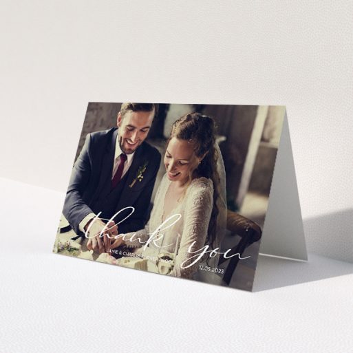 A wedding thank you card design called 'Handwritten Thanks'. It is an A5 card in a landscape orientation. It is a photographic wedding thank you card with room for 1 photo. 'Handwritten Thanks' is available as a folded card, with mainly white colouring.