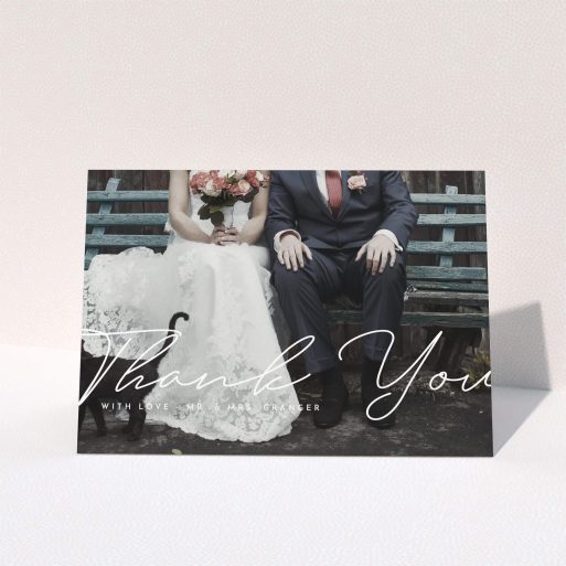 A wedding thank you card design named "Hermes". It is an A5 card in a landscape orientation. It is a photographic wedding thank you card with room for 1 photo. "Hermes" is available as a folded card, with mainly white colouring.