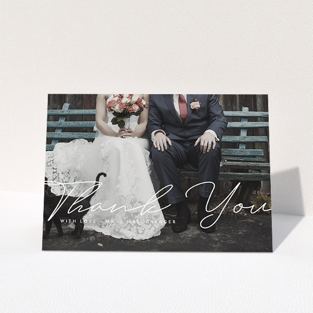 A wedding thank you card design named "Hermes". It is an A5 card in a landscape orientation. It is a photographic wedding thank you card with room for 1 photo. "Hermes" is available as a folded card, with mainly white colouring.