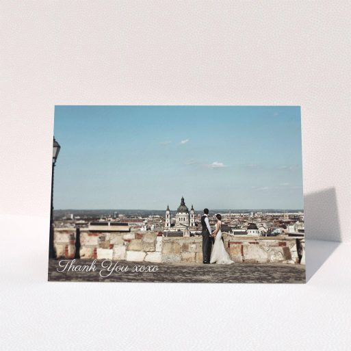 A wedding thank you card named "Italianno". It is an A5 card in a landscape orientation. It is a photographic wedding thank you card with room for 1 photo. "Italianno" is available as a folded card, with mainly white colouring.