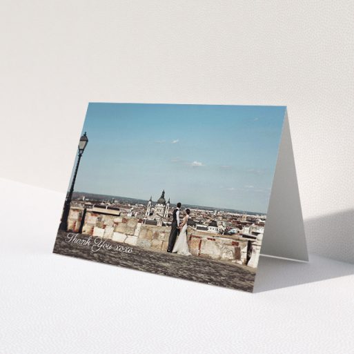 A wedding thank you card named 'Italianno'. It is an A5 card in a landscape orientation. It is a photographic wedding thank you card with room for 1 photo. 'Italianno' is available as a folded card, with mainly white colouring.