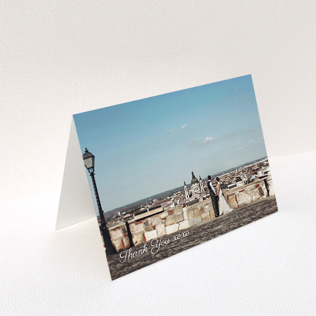 A wedding thank you card named "Italianno". It is an A5 card in a landscape orientation. It is a photographic wedding thank you card with room for 1 photo. "Italianno" is available as a folded card, with mainly white colouring.