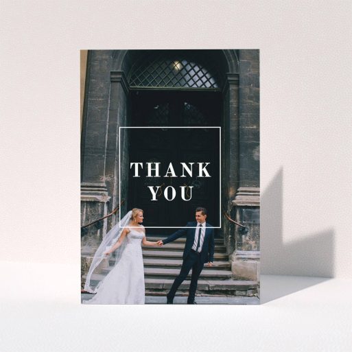 A wedding thank you card template titled "Just the outline". It is an A5 card in a portrait orientation. It is a photographic wedding thank you card with room for 1 photo. "Just the outline" is available as a folded card, with mainly white colouring.