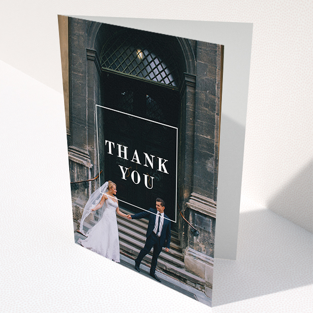A wedding thank you card template titled "Just the outline". It is an A5 card in a portrait orientation. It is a photographic wedding thank you card with room for 1 photo. "Just the outline" is available as a folded card, with mainly white colouring.