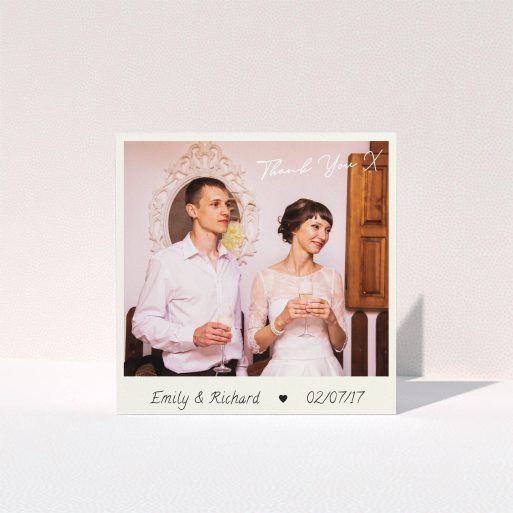 A wedding thank you card named "Keepsake". It is a square (148mm x 148mm) card in a square orientation. It is a photographic wedding thank you card with room for 1 photo. "Keepsake" is available as a folded card, with tones of cream and navy blue.