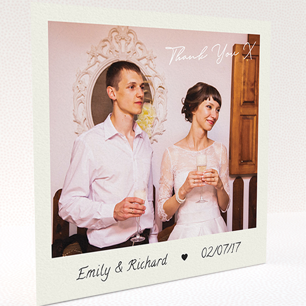 A wedding thank you card named "Keepsake". It is a square (148mm x 148mm) card in a square orientation. It is a photographic wedding thank you card with room for 1 photo. "Keepsake" is available as a folded card, with tones of cream and navy blue.