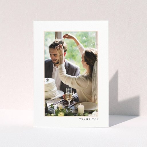 A wedding thank you card template titled "Little pink border". It is an A5 card in a portrait orientation. It is a photographic wedding thank you card with room for 1 photo. "Little pink border" is available as a folded card, with mainly white colouring.