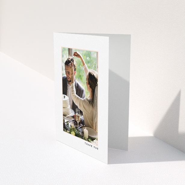 A wedding thank you card template titled "Little pink border". It is an A5 card in a portrait orientation. It is a photographic wedding thank you card with room for 1 photo. "Little pink border" is available as a folded card, with mainly white colouring.