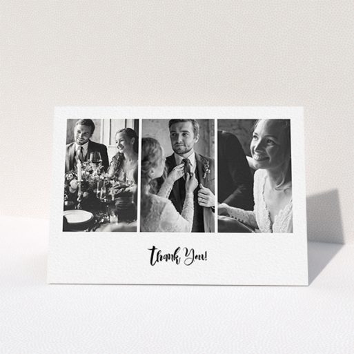 A wedding thank you card named "Modern Tryptic". It is an A6 card in a landscape orientation. It is a photographic wedding thank you card with room for 3 photos. "Modern Tryptic" is available as a folded card, with mainly white colouring.