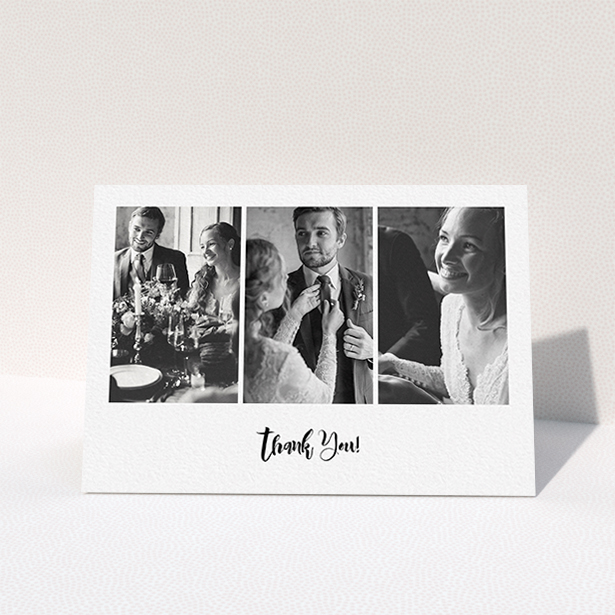 A wedding thank you card named "Modern Tryptic". It is an A6 card in a landscape orientation. It is a photographic wedding thank you card with room for 3 photos. "Modern Tryptic" is available as a folded card, with mainly white colouring.