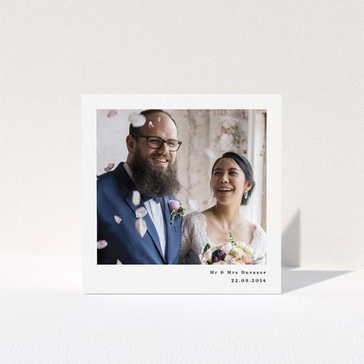 A wedding thank you card design named "Most of the page". It is a square (148mm x 148mm) card in a square orientation. It is a photographic wedding thank you card with room for 1 photo. "Most of the page" is available as a folded card, with mainly white colouring.