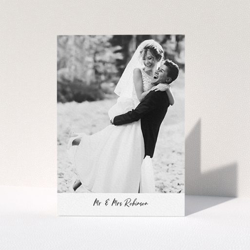 A wedding thank you card design called "Mr & Mrs Footer". It is an A6 card in a portrait orientation. It is a photographic wedding thank you card with room for 1 photo. "Mr & Mrs Footer" is available as a folded card, with mainly white colouring.
